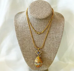 Beautiful vintage fashion designer necklace with decorated egg pendant with bow